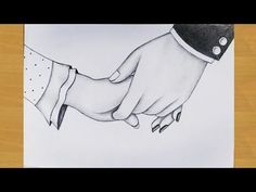 a drawing of two hands holding each other's hand on top of a piece of paper