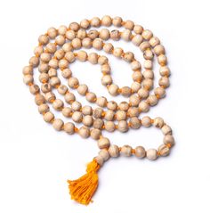 PRICES MAY VARY. SPECIFICATIONS: This authentic Tulsi Kanthi beads Necklace is Handmade, Sewn into a Garland with a Heavy Duty Thread. It has 108 + 1 guru beads. This Healing Rosary Spiritually Energized Mala Tulsi (Tulasi) Japa Mala or Holy Basil Wood Mala made from Hand Carved, Very light brown wood beads. ORIGIN: The name "Tulasi" means "She Who is Incomparable”. Tulasi, Tulsa or Vrinda Devi, the Goddess of Vrindavana. Tulsi also has Medicinal Properties – It is considered Divine and used for Spiritual Gemstone Beads For Rituals, Traditional Yellow Gemstone Beads Necklace, Spiritual Round Beads Mala For Puja, Spiritual Mala With Round Beads For Puja, Spiritual Mala For Puja With Round Beads, Bohemian Beaded Necklace With 108 Beads For Puja, Spiritual Wooden Beaded Necklaces For Festivals, Adjustable Polished Beads For Festivals, Spiritual Wooden Beads For Puja