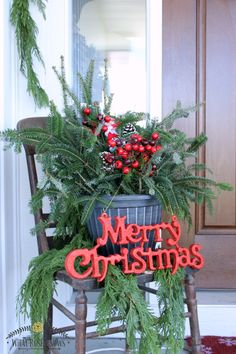 a christmas planter sitting on top of a wooden chair