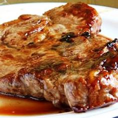 a piece of steak is sitting on a plate