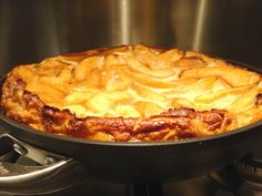 an apple pie sitting on top of a stove