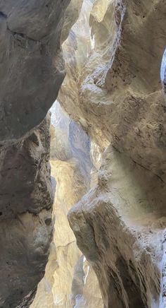 a man standing on top of a rock formation