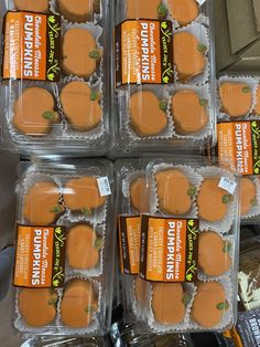 six packaged sandwiches in plastic containers on display