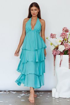 Mint maxi dress Lined Pluning neckline Halterneck Tiered ruffle detail Zipper in back Heads will turn when you float by in our gorgeous Catalina maxi dress. We are osessed with its tiered ruffle detail. Perfect for a wedding or birthday soiree. Team it with strappy heels and a clutch for an unforgettable look. MODEL INFO Model is wearing size XS Height: 5'7" Bust: 34" Waist: 24" Hips: 34" SIZE INFO Flat garment measurements This was manually measured from the actual garment Sizing may vary by 0. Spring Backless Ruffled Dress For Brunch, Spring Maxi Backless Dress For Date Night, Summer Floor-length Maxi Dress With Ruffle Hem, Chic Floor-length Maxi Dress With Ruffle Hem, Chic Ruffled Maxi Dress For Vacation, Chic Backless Maxi Dress For Brunch, Maxi Length Beach Dresses With Ruffle Hem, Flowy Maxi Ruffle Dress For Vacation, Beach Dresses With Ruffle Hem Maxi Length