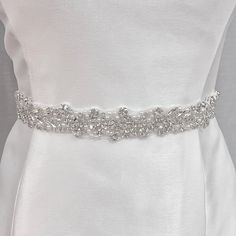 Sparkle on your special day with this stunning bridal belt. She is adored with glistening pearls, and sparkling rhinestones, shine bright as a modern bride with this dazzling accessory!! 🤍 DETAILS * Embellishment measures approximately 1.2 inches wide * Designed with sparkling rhinestones and glistening pearls * Available in 17.5 inches with ribbon that measures 106 inches long if you want to tie it in a bow; * or 35 inches if you want to attach the belt to your dress * Made-to-order, ships wit Rhinestone Wedding Dress, Simple Veil, Pearl Belt, Beaded Veils, Drop Veil, Pearl Veil, Bridal Sash Belt, Wedding Belt, Wedding Dress Belt