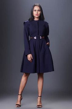 Navy blue fit and flare jacket style dress in a solid base. Comes with embroidered belt.
Components: 2
Pattern: Embellished
Type Of Work: Applique,Cutdana
Neckline: Mandarin Collar
Sleeve Type: Full
Fabric: Ponte Roma
Color: Blue
Other Details: 
Length:
Dress: 38 inches
Sleeves: 22 inches
Closure: Front button
Occasion: Party - Aza Fashions Chic Blue Dress With Belted Cuffs, A-line Dresses With Belted Cuffs, Blue Midi Dress With Belted Cuffs, Elegant Blue Dresses With Belted Cuffs, Blue Knee-length Belted Dress, Blue Belted Dress For Work, Blue Fitted Dress With Belted Cuffs, Blue Dresses With Belted Cuffs, Fitted Knee-length Belted Outerwear