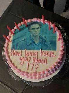 a birthday cake with an image of robert patties on it that says, how long have you been 17?