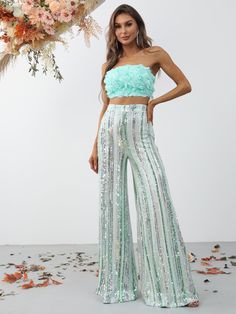 Product Code: FSWU8074 Embellishment: Sequin Fabric: 100% Polyester Back Style: Zipper Up Fully Lined: Yes Built-in Bra: No Available Color: Mint Stretch: Moderate Fits true to size Imported Model Information: Height: 5' 2" Bust: 33.5'' Waist: 24“ Hips: 35.5” wearing US size Small Flower Tube Top, Bach Themes, Sequin Wide Leg Pants, Mode Purple, Crop Tube Top, Trendy Outfits Indian, Indian Dresses Traditional, Party Wear Indian Dresses, Indian Wedding Outfits