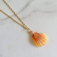 Hawaiian Sunrise Shell Necklace~ This necklace has a gorgeous orange and pink wire wrapped Hawaiian sunrise shell on gold fill rolo chain with a pink coral bead and three coral beads at the end for an elegant look. Sunrise shells are only found in Hawaii, a true gem to the islands and collectors.  Shell approx. 20mm. Chain is adjustable 19-20" Model wearing similar necklace Checkout our sunrise shell jewelry~ https://www.etsy.com/shop/HanaMauiCreations?ref=seller-platform-mcnav&search_query=sunr Handmade Yellow Gold Necklaces For The Beach, Gold Wire Wrapped Necklace For The Beach, Wire Wrapped Shell Necklaces, Wire Wrapped Shell Necklaces In Shell Shape, Beachy Jewlery, Sunrise Shell Jewelry, Gold Wire Wrapped Shell Necklace, Sunrise Shell Necklace, Gold Wire-wrapped Necklaces For The Beach