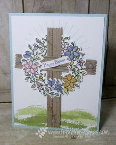 a card with a cross and flowers on it