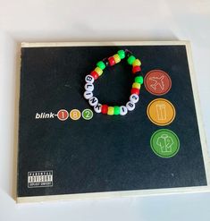 Blink-182 take off your pants and jacket bracelet i made :D Take Off Your Pants And Jacket Blink 182, Kandi Patterns Bracelets, Blink Concert, Pop Punk Fashion, Diy Kandi, Kandi Ideas, Perler Ideas, Bracelet Inspo