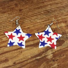 These amazing patriotic red, white and blue clay star earrings are perfect to wear on the 4th of July, Flag Day and Memorial Day.  They're made with white polymer clay cut into a star shape with small red and blue clay stars.  Wear them with all your favorite summer outfits.  They dress up a plain or patriotic t-shirt but will also look cute with a dress or skirt.  These patriotic star earrings are super lightweight and comfortable to wear all day long.  Get ready to have all your friends, famil Patriotic Red Star-shaped Earrings, Patriotic Blue Earrings For Independence Day, Blue Patriotic Earrings For Independence Day, Patriotic Earrings For 4th Of July, Patriotic Red Star Earrings, Patriotic 4th Of July Earrings, Patriotic Multicolor Earrings For Independence Day, Multicolor Earrings For Independence Day Gift, Patriotic Earrings For 4th Of July Gift