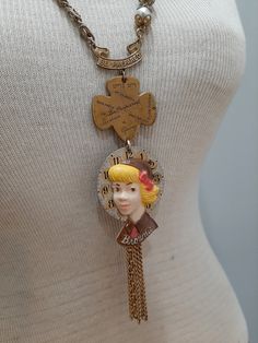 This unique and one of a kind assemblage necklace features various vintage Girl Scout and Brownie pins, along with two different vintage chains and pearls.   The Brownie girl is a 1950s celluloid pin, attached to an antique pocket watch dial.   Necklace length is about 28-30 inches long--slides easily over the head. Retro Brass Necklaces For Vintage Collection, Handmade Vintage Chain Necklace, Vintage Charm Necklaces For Jewelry Making, Vintage Handmade Metal Chain Necklace, Vintage Charm Necklace With Adjustable Chain, Handmade Vintage Metal Chain Necklace, Antique Gold Retro Jewelry For Vintage Collection, Handmade Vintage Style Chain Necklace As Gift, Vintage Collectible Charm Necklaces