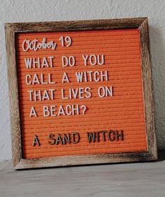 an orange sign that says, october 19 what do you call a witch that lives on a beach?