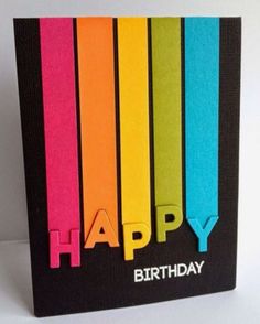 a birthday card with colorful crayons in the shape of letters that spell out happy