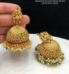 Jadau peacock Kemp Ruby Stones Jhumka Earrings/Light weight /Antique Gold Finish/Indian Jewelry/desi jewelry / indian jhumkas Size : Approx 3 inches  Best use for gifting purposes. It can be wore on any occasion and with any outfit. You can gift this to your sister as Diwali gift  OCCASION: PARTY WEAR, WEDDING, MARRIAGES, CASUAL, DAILY WEAR These Earrings set have an excellent finish Ideal Gift Idea: Perfect beautiful & memorable gift for you and your loving wife, girlfriend, sister, aunt, daughter, and mom/mother/mummy. CARE Avoid Contact With Chemicals Such As Perfumes Or Any Sprays. Avoid Contact With Water. Use Butter Paper Or Cotton Cloth To Store Your Jewellery For A Longer Product Life. OFFER!! OFFER !!  BUY $35 Items from my shop and get Guaranteed Free Shipping!! Desi Jewelry, Loving Wife, Peacock Pearl, American Diamond Necklaces, Western Earrings, Jewelry Indian, Jhumka Earrings, Ruby Stone, Acrylic Earrings