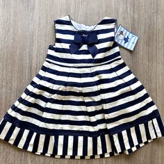 Nwt Chebelle Striped Dress Is Adorable! Navy And White Stripe Dress With Grosgrain Bow And Trim, Box Pleats On The Skirt, And A Tie Back. Perfect Condition Never Worn Smoke Free Home Cute Navy Dress For Dress-up Occasions, Cute Navy Sleeveless Dress, Cute Sleeveless Navy Dress, Navy Cotton Playtime Dress, Navy Cotton Dress For Playtime, Holiday Formal Dresses, Vintage Prairie Dress, Lace Ruffle Dress, Blue Cable Knit Sweater