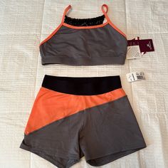 2 Piece. Never Worn. Small Adult. Orange Athleisure Activewear With Built-in Shorts, Fitted Orange Activewear For Workout, Fitted Orange Sportswear Activewear, Orange Athletic Sportswear Shorts, Orange Moisture-wicking Shorts Activewear, Orange Moisture-wicking Activewear Shorts, Orange Moisture-wicking Short Activewear, Summer Orange Yoga Activewear, Orange Athletic Shorts With Built-in Shorts For Gym