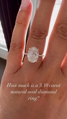 a woman's hand with a ring on it and the words how much is a 3 carat natural oval diamond ring?