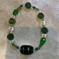 Vintage Murano, Crystal And Mixed Bead Stretch Bracelet Fits 7” Wrist Green, Clear And Gold Beads Not All Beads Are Glass Green Stretch Bracelet With Colorful Beads, Green Beaded Stretch Bracelet, Elegant Green Stretch Bracelet With Colorful Beads, Casual Green Jewelry With Large Beads, Green Adjustable Glass Beaded Bracelets, Adjustable Green Glass Beaded Bracelets, Green Glass Bracelets With Colorful Beads, Elegant Green Beaded Bracelets With Large Beads, Green Bracelets With Colorful Glass Beads