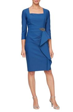 Be the topic of cocktail conversation in a chic sheath dress accented with bejeweled bauble and a rippling ruffle. 40" length (size 8) Hidden back-zip closure Square neck Three-quarter sleeves Partially lined 78% nylon, 22% spandex Hand wash, dry flat Imported Elegant Embellished Dresses For Work, Elegant Embellished Workwear Dresses, Elegant Mother Of The Bride Dress With Ruffles, Dressy Mother Of The Bride Cocktail Dress, Dressy Cocktail Mother Of The Bride Dress, Chic Formal Knee-length Mother Of The Bride Dress, Elegant Fitted Cocktail Dress For Mother Of The Bride, Elegant Embellished Dress With Asymmetrical Neckline, Elegant Formal Mother Of The Bride Dress With Ruffles