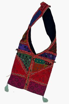 This artisanal Banjara shoulder bag, crafted with intricate mirror patchwork, is a perfect blend of functionality and style. The handmade handbag features a secure top zipper, ensuring your essentials are kept safe while on the move. With its bohemian chic design, this handcrafted accessory adds a unique charm to any outfit, making it a versatile addition to your collection. Perfect for those who appreciate the beauty of Banjara handbags and the artistry of handmade craftsmanship. Disclaimer: Th Hippie Multicolor Patchwork Bag, Multicolor Patchwork Hippie Shoulder Bag, Festival Patchwork Tote Bag, Multicolor Hippie Shoulder Bag With Patchwork, Hippie Multicolor Patchwork Shoulder Bag, Rectangular Patchwork Shoulder Bag For Festivals, Bohemian Patchwork Hobo Shoulder Bag, Bohemian Patchwork Hobo Bag For Everyday Use, Bohemian Patchwork Hobo Tote Bag