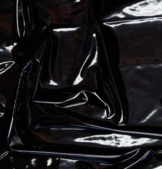 shiny black material is shown in close up