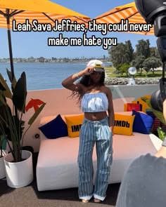 a woman standing in front of a couch with an umbrella over her head and the caption reads, leah sav jeffs they's they could never make me hate you