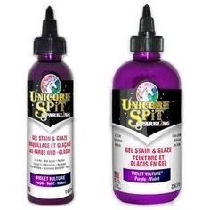 two bottles of purple liquid sitting next to each other on a white background with the words unicorn spirit