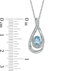 Celebrate her December birthday with this eye-catching and elegant fashion pendant. Created in sleek sterling silver, this double looping teardrop-shaped frame glistens with intricate beaded detailing and a scattering of shimmering diamond accents. At the center of the frame, a 6.0 x 4.0mm oval-shaped regal blue topaz completes the design. Polished to a brilliant shine, this enchanting pendant suspends along an 18.0-inch rope chain that secures with a spring-ring clasp. Blue Topaz Teardrop Pendant For Anniversary, Blue Topaz Teardrop Pendant Jewelry For Anniversary, Teardrop Blue Topaz Jewelry With Diamond Accents, Luxury Teardrop Blue Topaz Jewelry With Diamond Accents, Loop Pendant, December Birthday, Fashion Pendant, Rope Chain, Spring Rings