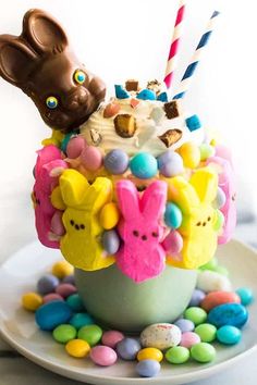 an ice cream sundae decorated with candy and candies