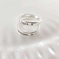 Every mom wants to hold her loved ones close. What better way than these gorgeous sterling silver hand stamped stacking name rings? Each sterling silver band measures approximately 4mm wide and is hand stamped with names of your choice. Rings may be given a hammered texture upon request. ♥ ♥ ♥ Please leave your personalization requests in the comments section at checkout. Please separate names with a comma. A tiny heart stamp will be used to separate each name (instead of comma), but if you pref Rings With Names, Mothers Ring Stackable, Mothers Rings, Stackable Name Rings, Gold Wedding Bands Women, Mommy Jewelry, Stackable Diamond Rings, Mother Rings, Name Rings