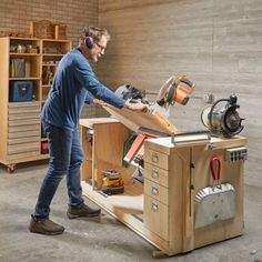 a man working on a workbench in a garage