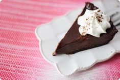 a slice of chocolate pie with whipped cream on top