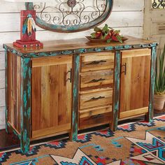 a wooden cabinet with metal handles and drawers in front of a white painted wood wall