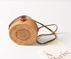 wickedafstore Koh Samui Crossbody Bag Bohemian Light Brown Shoulder Bag For The Beach, Beige Crossbody Straw Bag With Bamboo Handle, Brown Crossbody Straw Bag With Bamboo Handle, Light Brown Crossbody Straw Bag For Vacation, Natural Straw Crossbody Bag With Bamboo Handle, Natural Crossbody Shoulder Bag With Bamboo Handle, Summer Brown Rattan Shoulder Bag, Natural Rattan Straw Bag With Adjustable Strap, Brown Rattan Shoulder Bag For Summer