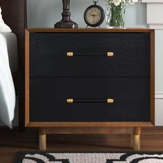 A study in design depth, this nightstand is a showstopper. A walnut-finished frame provides a stunning contrast to its brass-capped legs and pulls, giving Justice a distinct couturier look. Everly Quinn Color: Walnut/Black | Everly Quinn Gleavy 2 - Drawer Nightstand 22.0 H x 23.0 W x 16.0 D in black / brownWood in Walnut / Black | 22" H X 23" W X 16" D | Wayfair Nightstand Black, Nightstand Wood, Black Nightstand, Primary Bedroom, 2 Drawer Nightstand, Furniture Renovation, Wood Nightstand, Bedroom Night Stands, Master Bedrooms Decor