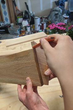 a person is working on a piece of wood