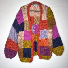 Frnch Paris Anthro Maelia Rainbow Chunky Knit Checkered Cardigan Sweater O/S Excellent Pre Owned Condition Puff Sleeves, Very Soft, Patchwork, Hand Knit, Oversize >> Style M522-82at >> 100% Acrylic >> Size One Size >> Bust 38“ >> Length 27“ >> Sleeve 23“ All Measurements Are Approximate. Please Check The Measurements, Vintage And Pre Owned Items Vary In Size. I Identify All Known Flaws, Please Note The Pictures As Additional Description To The Condition. I Ship Within 24 Hours, Except On Sunday. Crochet Colorful Cardigan, Fall Knit Cardigan With Patchwork, Fall Patchwork Knit Cardigan, Knit Patchwork Cardigan For Fall, Red Patchwork Knit Sweater, Red Knit Sweater With Patchwork, Multicolor Knitted Outerwear For Layering, Red Patchwork Sweater, Multicolor Wool Sweater With Patchwork