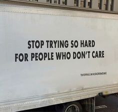 a white truck with black writing on the side