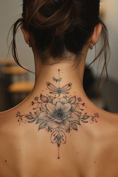 a woman with a tattoo on her back neck