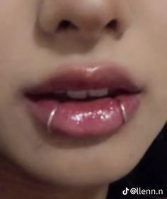 a close up of a person's lips with clear, shiny lipstick