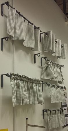 several pieces of cloth hanging on the wall