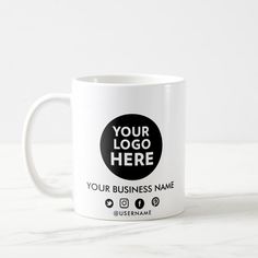 a white coffee mug with the words your logo here on it and an image of a black circle