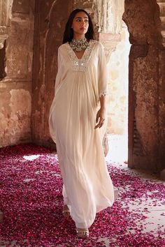 Ivory draped kaftan with resham, thread, mirror, glass bead, pearl embroidery in floral pattern and tassel detailing on sleeves. - Aza Fashions Draped Kaftan, Desert Clothing, Ivory Drapes, Kaftan Pattern, Chiffon Embroidery, Kaftan Women, Kaftan For Women, Pearl Embroidery, Beaded Neckline