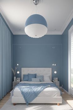 a bedroom with blue walls and white furniture