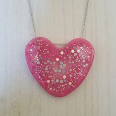 Large Pink Heart With Holographic Glitter On A Silver Tone Chain. Chain Measures Approx 18.5 Inches. Trendy Silver Heart Necklace For Party, Cute Heart Necklace For Parties, Cute Heart Necklace For Party, Cute Heart Necklace For Valentine's Day Party, Cute Silver Heart Charm Necklace, Silver Heart Charm Necklace For Party, Cute Silver Heart Necklace For Valentine's Day, Silver Heart Beads Necklace For Party, Handmade Heart Necklace For Party