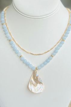 Get summer ready with this beautiful boho necklace! Made with Genuine Aquamarine gemstones in beautiful blue hues and accented with small shell beads, gold beads, and gorgeous Abalone Shell Pendant. Also comes with a beautiful gold layering necklace for an extra styled look as a gift. This piece is customizable and beautifully made, a perfect gift Mother's Day, birthdays, showers, Anniversary gifts, best friend gifts and anytime wear.  Please choose your custom size at check out!  Each piece comes in an elegant drawstring gift bag as shown and a free gold necklace!  Please contact me with any questions.  Shipping Every item is carefully wrapped for shipment and includes a small keepsake adjustable woven bag. Shipping is fast and sent out the next day via usps first class mail. Message me w Necklace Shell, Stone Beaded Necklace, Friend Gifts, Gold Necklace Layered, Shell Necklace, Shell Jewelry, Boho Gifts, Aquamarine Gemstone, Layering Necklace