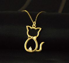 "10K 14K 18K Solid Gold. Gold Cat Necklace, Dainty Gold Charm Pendant, Tiny Cat Necklace, Christmas Gift, Birthday Gift, Gift for Friend According to prehistoric beliefs, cats are lucky animals. All jewelry in our collection are real solid gold and completely handmade accessories. The jewelry in our collection, which is an accessory with a bright and eye-catching beauty that will make others notice you and your loved ones in the environments you enter, is a great gift option to add value to the Elegant Cat Design Jewelry For Party, Elegant Party Jewelry With Cat Design, Gold Jewelry With Cat Design For Party, Elegant Cat Design Necklace For Anniversary, Gold Cat Design Jewelry For Anniversary, Valentine's Day Gold Cat Design Jewelry, Lucky Animals, Cat Necklace Gold, Tiny Cats