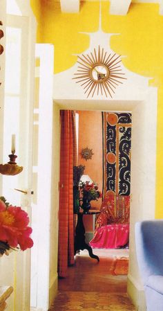 an open door leading into a brightly colored room